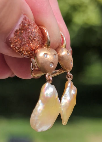 Thumbnail: hook earrings with pear shaped pearls dangling from brushed rose gold heart set with 3 small round diamonds