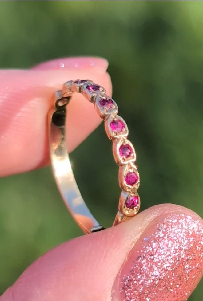 Thumbnail: vintage yellow gold half eternity ring set with rubies