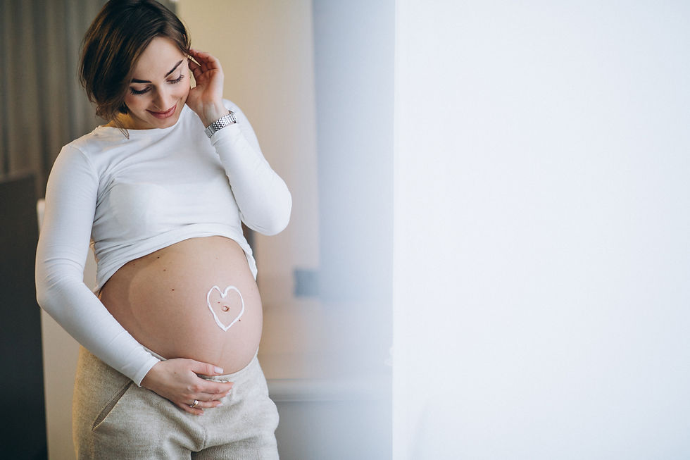 pregnant-woman-applying-cream-belly-prevent-stretches.jpg