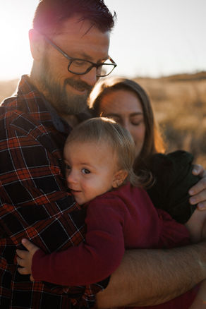 Candid toddler photo hugging dad Rockhampton golden hour