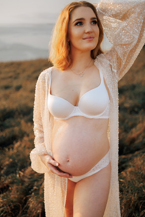 Expecting mother framed by early morning light in scenic Yeppoon location