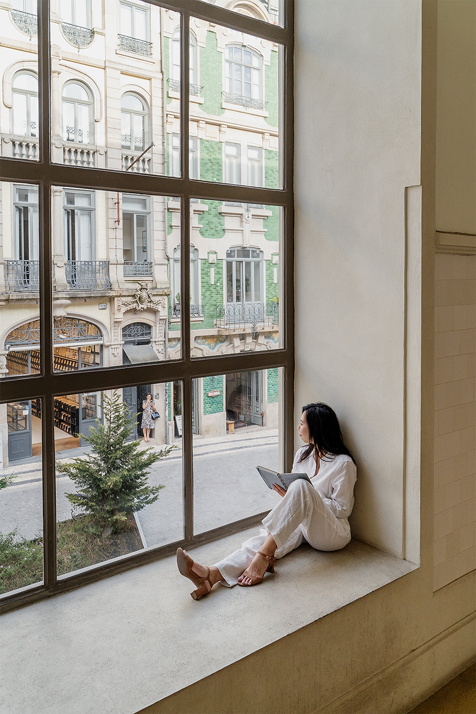 Wendy sitting in a window in Porto image