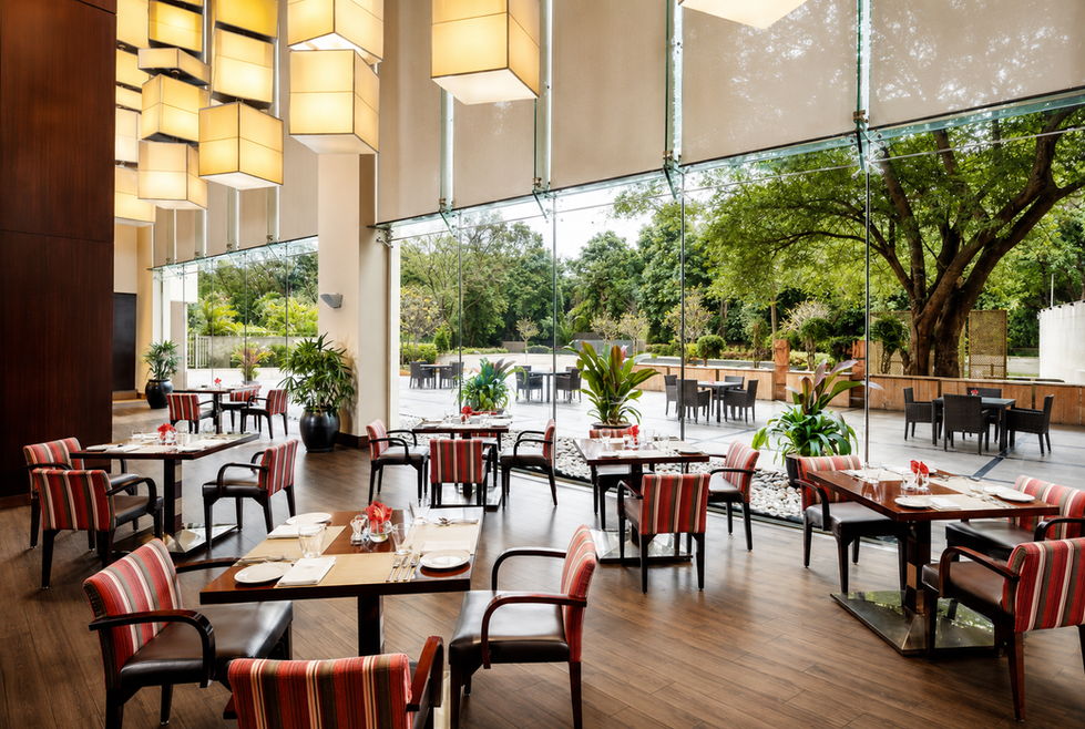 Custom dining chairs, restaurant tables, and luxury interior seating fit-out at Renaissance Hotel