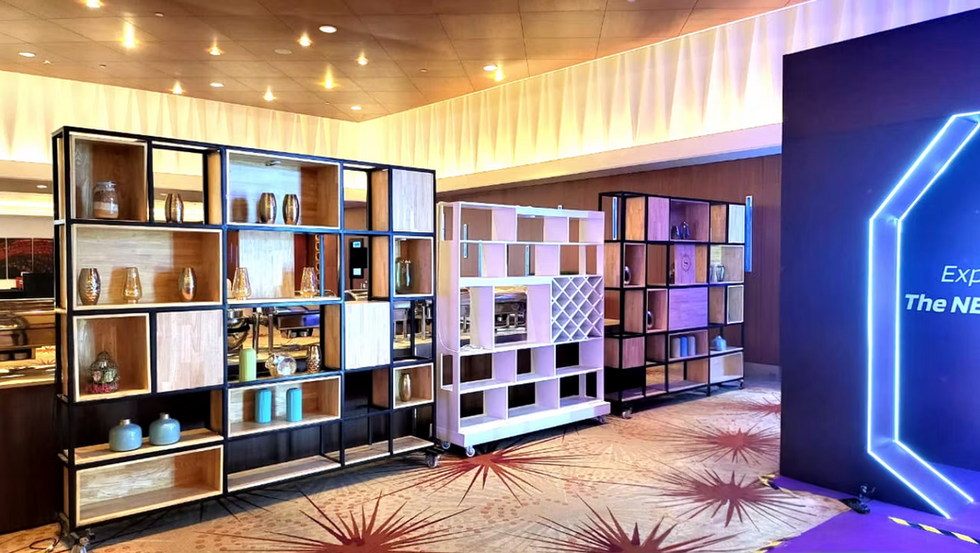 Custom backlit geometric shelving unit and room divider in hotel lobby lounge at an event in Brigade Sheraton Hotel
