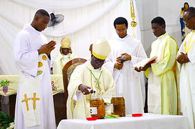Most Rev. John Baptist Attakruh pouring the balsam to the Oil of Chrism 