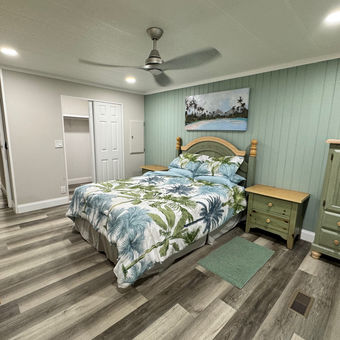 Mobile Home BedRoom Remodelling. Vinyl plank flooring installation, floor replacement, accent walls, ceiling fan replacement, recessed lighting installation, interior design, interior painting.