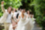 Happy wedding group outdoors