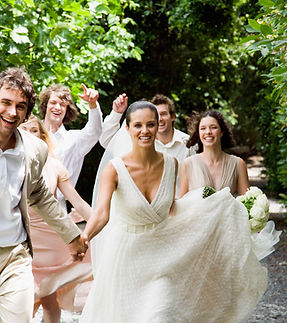 Happy wedding group outdoors