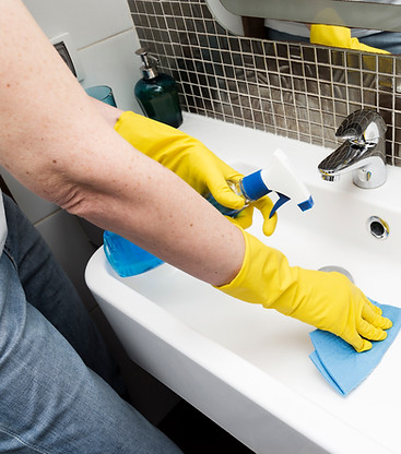 woman-with-rubber-gloves-cleaning-sink.jpg