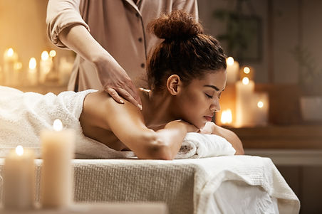 tender-african-woman-smiling-enjoying-massage-with-closed-eyes-spa-resort.jpg