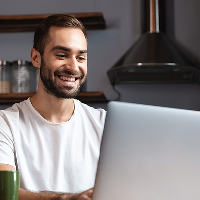 photo-unshaved-man-30s-wearing-casual-t-shirt-using-silver-laptop-while-sitting-table-mode