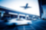blurred-street-scene-city-with-plane-flying.jpg