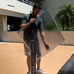 Window cleaner performing screen cleaning after residential window cleaning