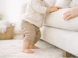 baby cruising along furniture