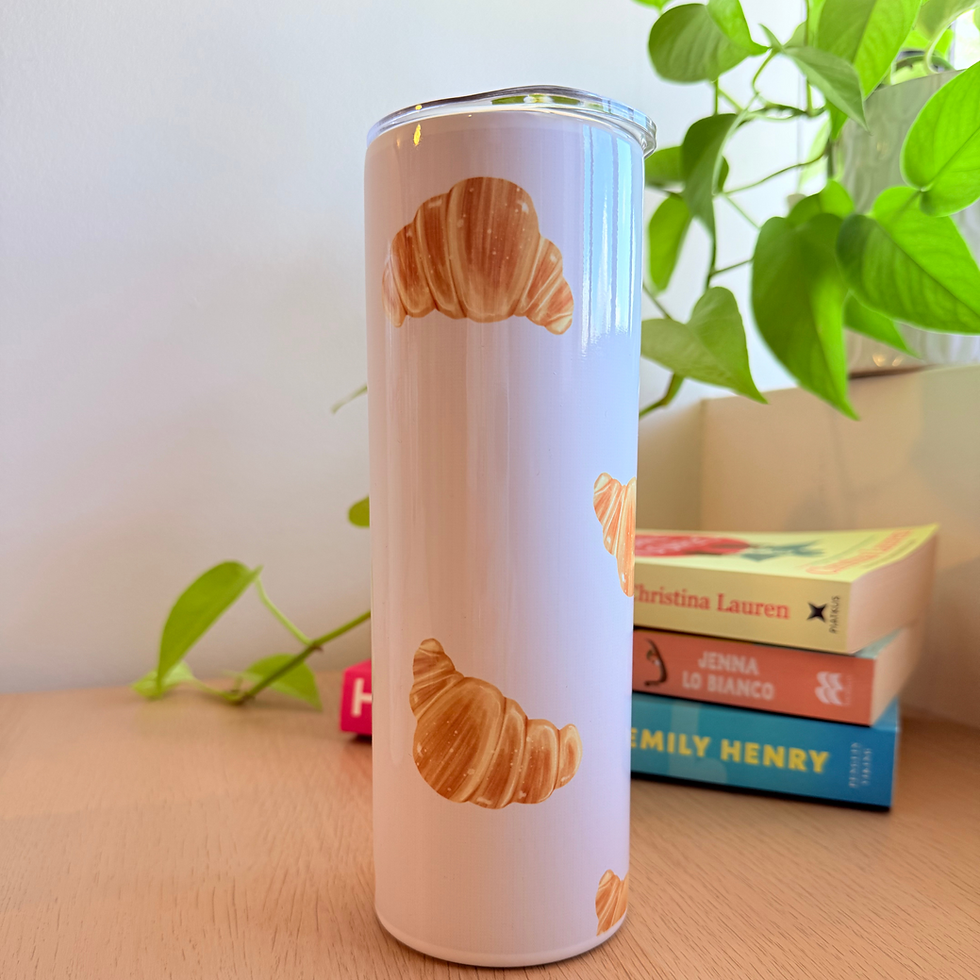 croissant pattern, pale pink background on a 20oz skinny tumbler