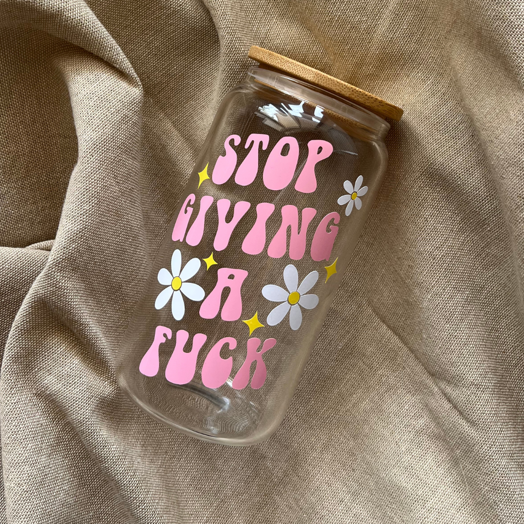 glass can tumbler with pink vinyl saying stop giving a fuck with flowers