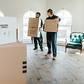 Professional cleaning team from Zolo Cleaning performing post-construction cleaning in a newly renovated home, removing dust,