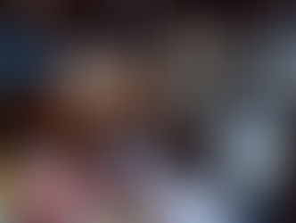 VEIN team members at the booth with a retro-inspired setup, featuring a vintage CRT television, Japanese vending machine decor, and automotive accessories on display.