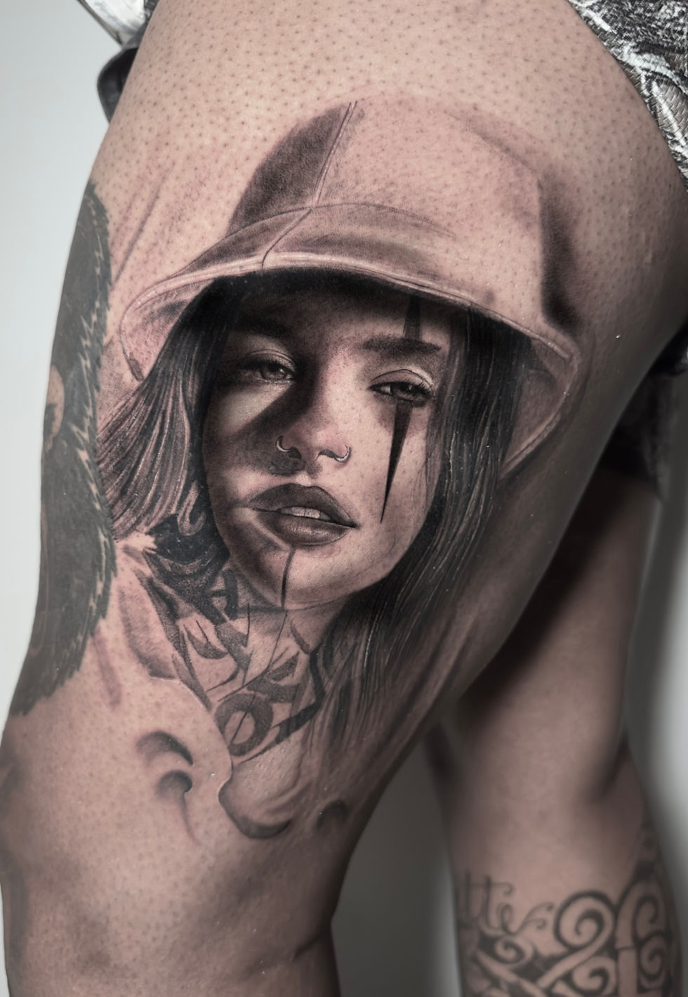 Hooded portrait — black and grey tattoo by Fabian Hellberg in NYC
