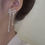 Thumbnail: Micro Set Rhinestone Bow Fringe Earrings