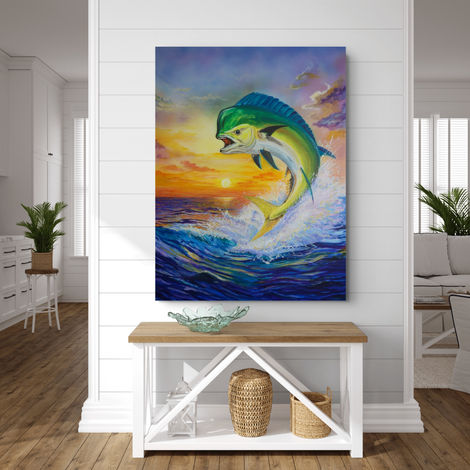 artist Ken Morningstars Mahi Sunrise of a mahi fish leaping out of the water in front of the sunrise on a wall over table