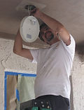 Ken installing light fixture
