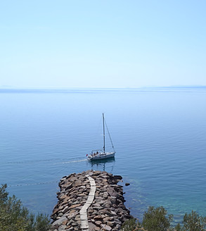 A ship sailing at sea, representing the first step toward a new direction through life coaching