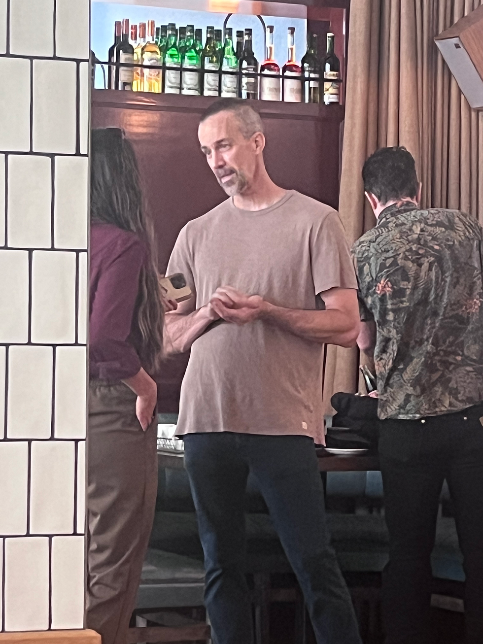 Chef Dean Neff speaks with one of the attendees of the first Community Conversation series with Cape Fear River Watch. Photo by S. Gentry
