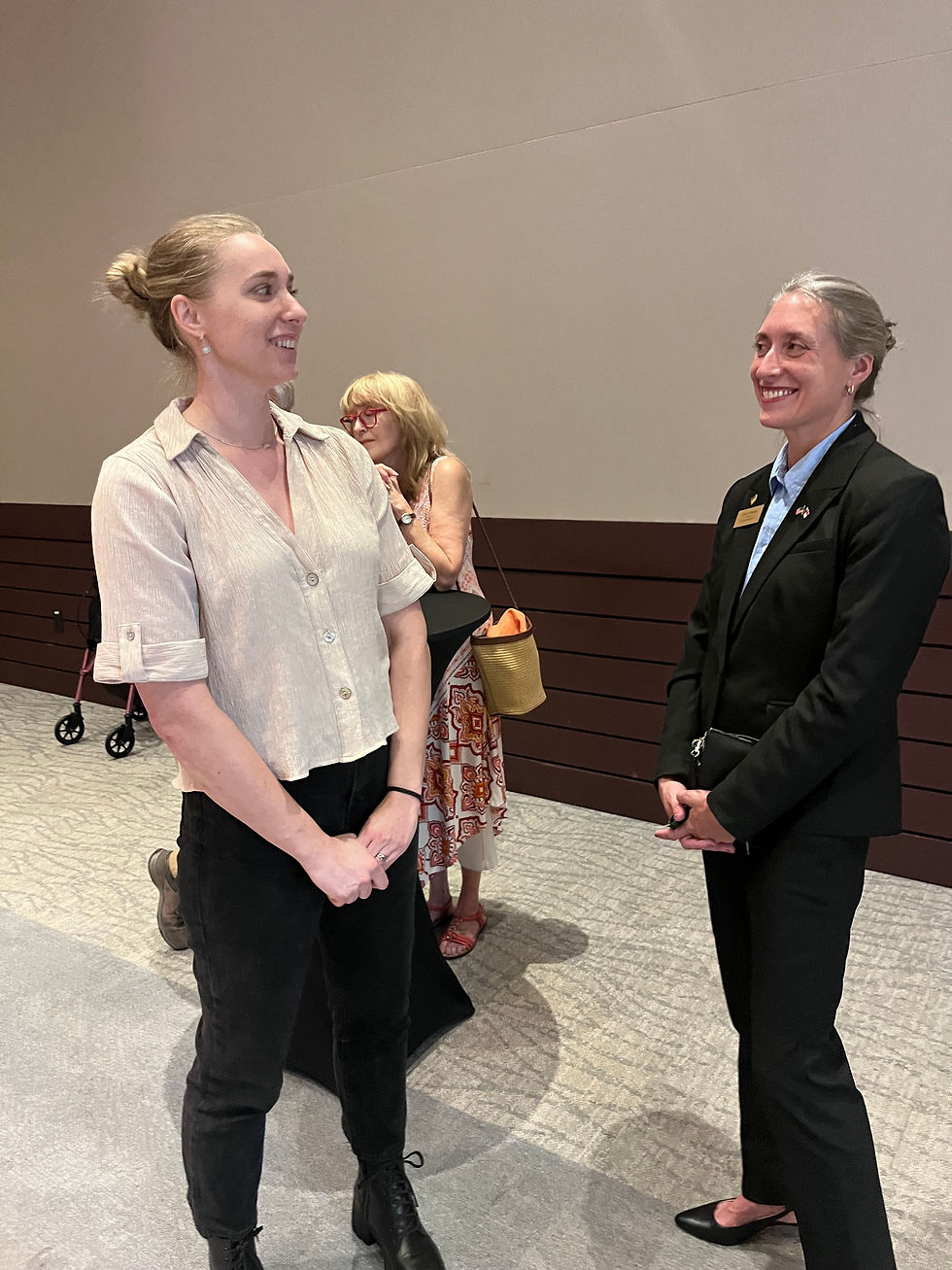 Lauren Krouse (left) speaks with Senate District 7 candidate Jessica Bichler (right). Photo by S. Gentry