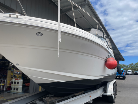 White boat with a high-gloss Tsunami ceramic coating finish on the hull.