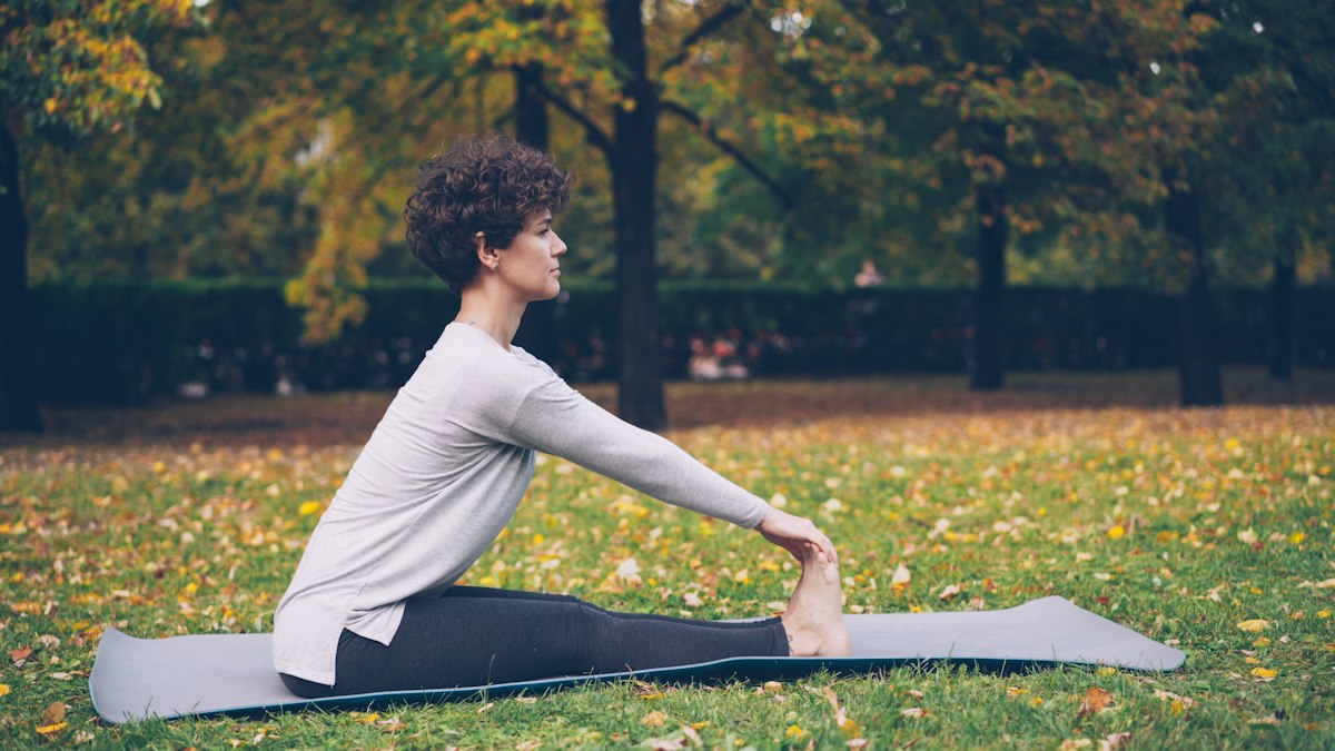Woman stretching on a mat