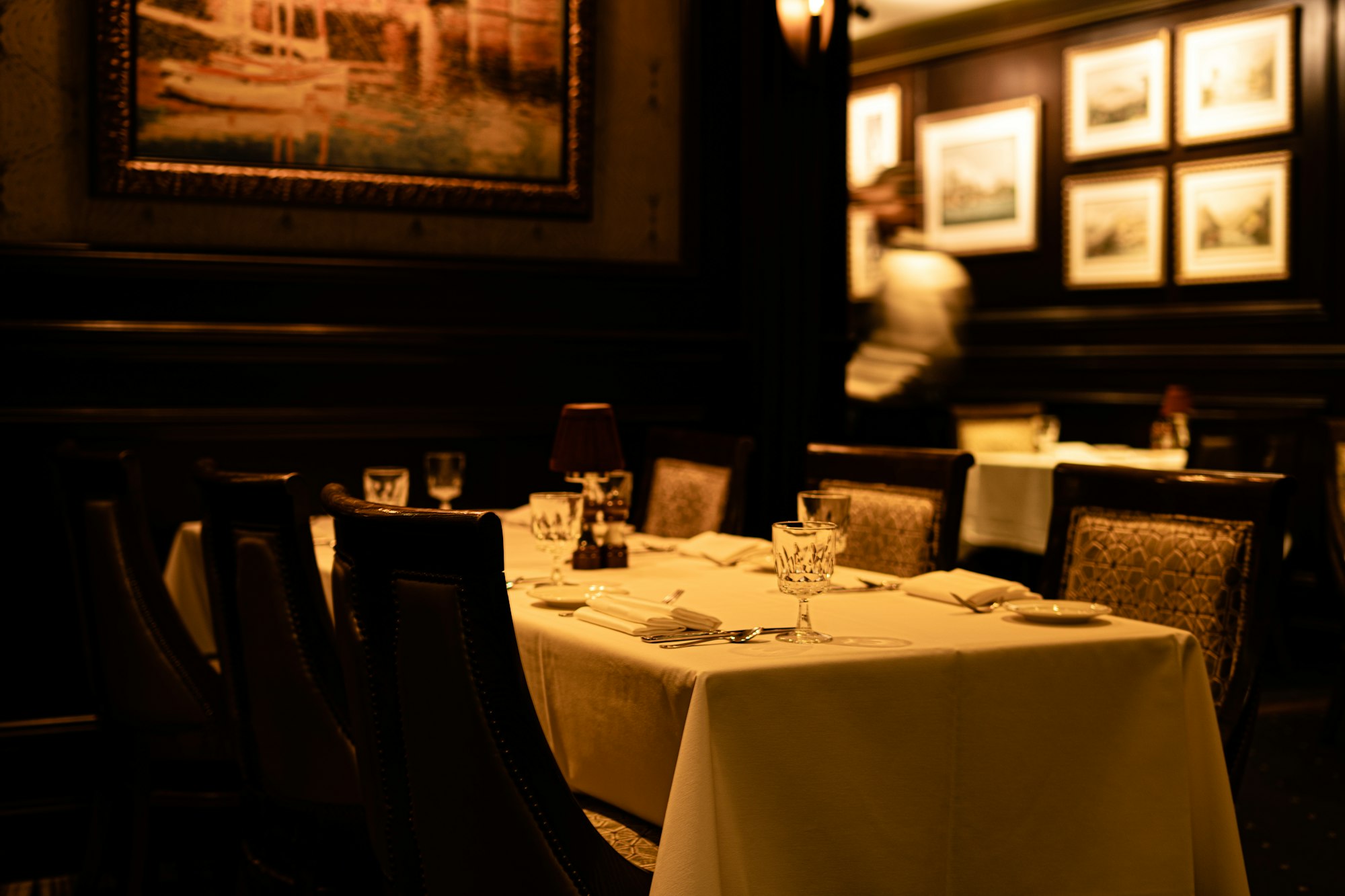 Elegant Italian restaurant dining room with white tablecloths
