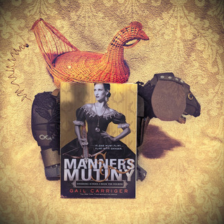 Manners and Mutiny next to a wicker chicken and a weenie dog