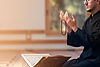 Man Praying Indoors