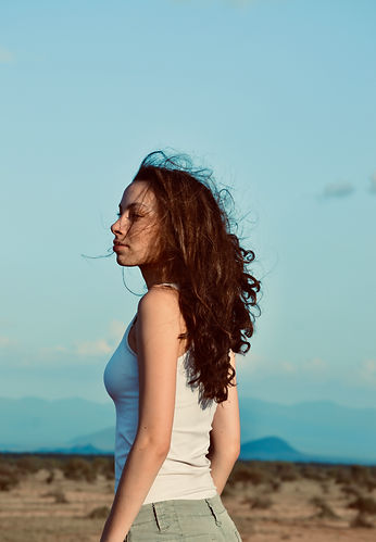 Woman in front of landscape