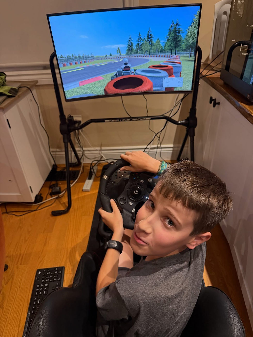 Zachary in the Next Level Racing Go Kart Plus simulator