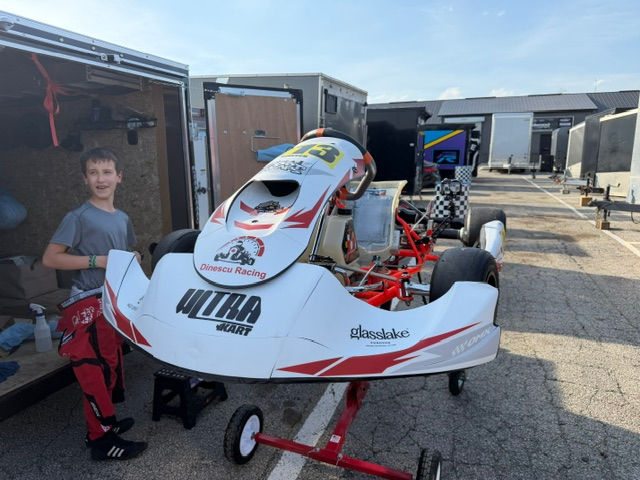 Dinescu Racing Kart with new OMX Graphics livery applied in the paddock at Goodwood Kartways.