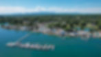 Aerial view of Fanchers Campground on Douglas Lake, featuring a boat dock and scenic mountain backdrop