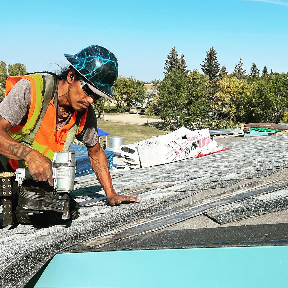 roof worker replacing shingles to lower heat in the house