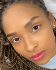 Portrait of a client with healed lip neutralization showing even, radiant lip tone.