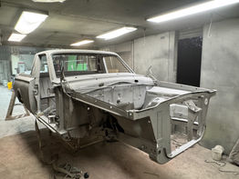 Classic car frame in a workshop ready for restoration Adelaide Sandblasting