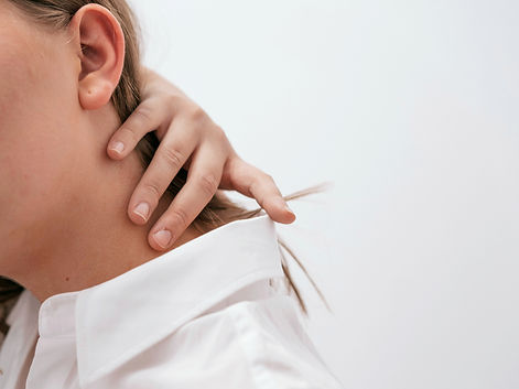 woman touching neck