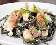 squid ink pasta- jalapeño pesto-garlic-rock-shrimp-sopressata-scallions