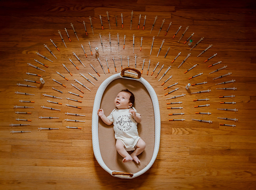 A baby stares up at the window surrounded by a rainbow of his mother's ivf needles used to conceive him