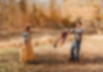a family plays in their backyard in fall