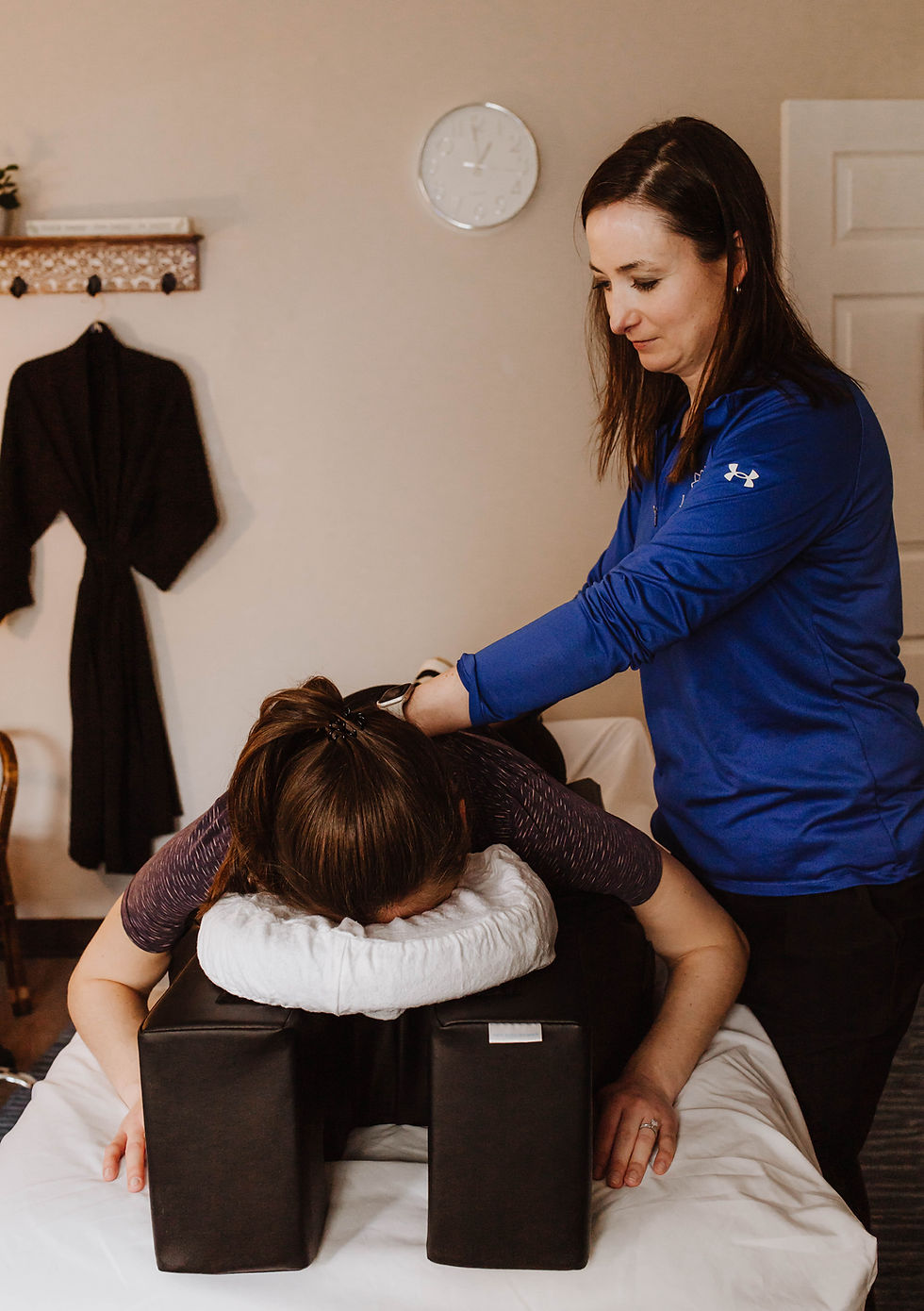 Janelle Antonio, physical therapist at Lotus Rehabilitation, practice myofascial release on a pregnant mother to release tension during a pelvic floor therapy appointment.