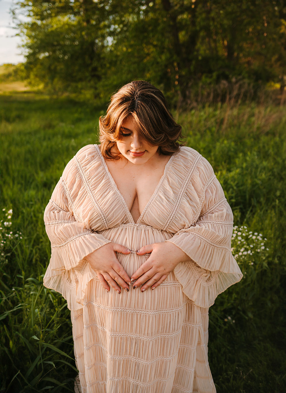 an image taken at a natrual land's stroud Preserve golden hour maternity session
