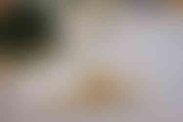 Wedding favours and place names. Tiny pots of local honey and sugared almonds