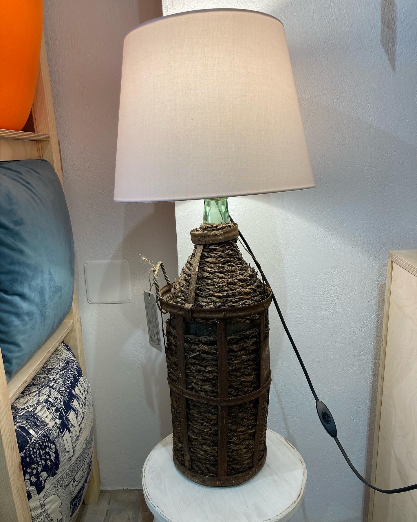 VINTAGE BOTTLE IN A BASKET LAMP