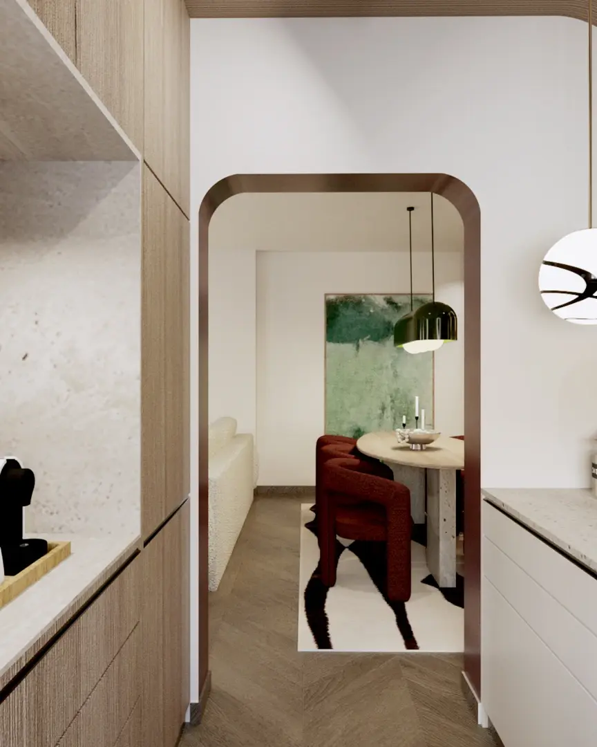 Kitchen-to-dining view with pendant lamp – Minimalist kitchen view toward dining area, featuring a dark green dome pendant over the dining table and subtle integrated under-cabinet task lighting.